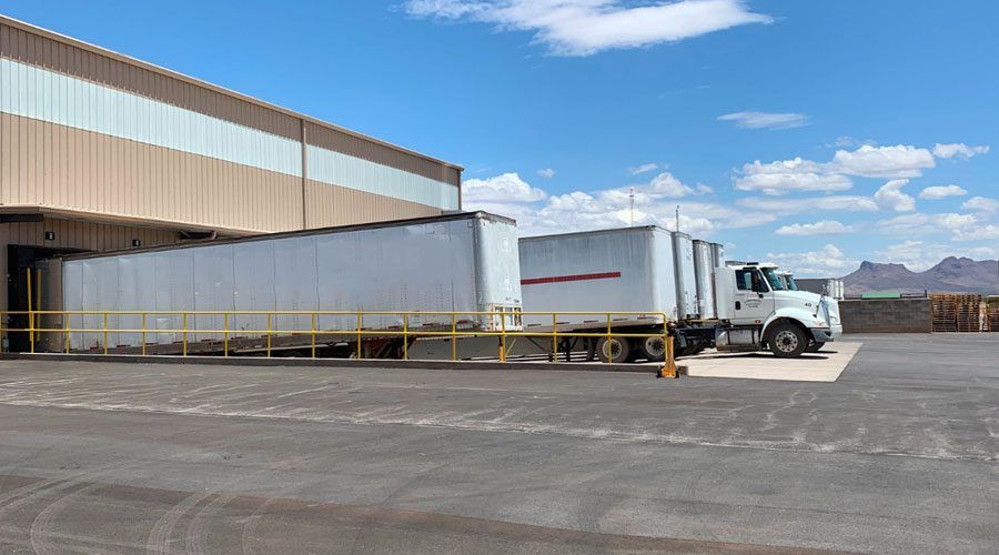 Tractor trailers at a warehouse